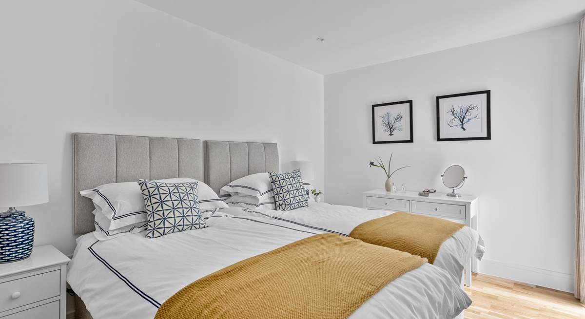 Twin beds await in the second bedroom.