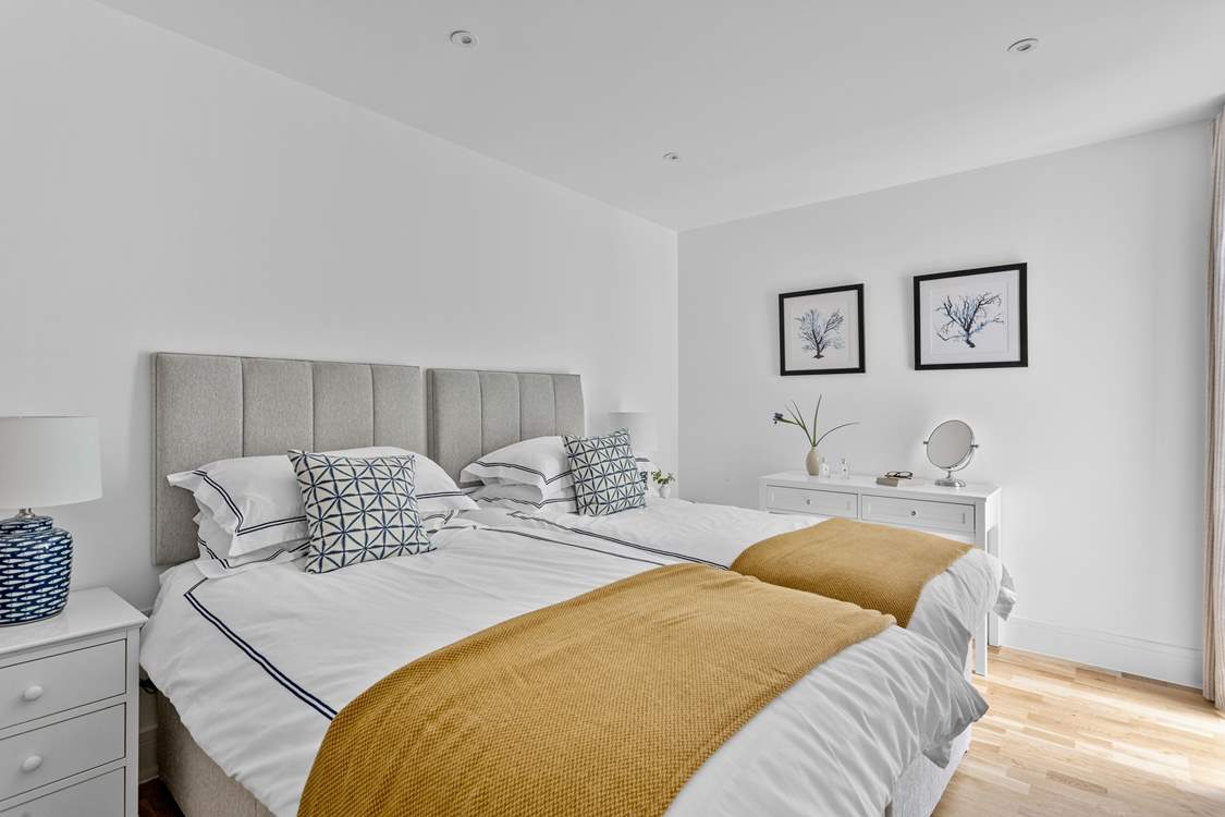 Twin beds await in the second bedroom.