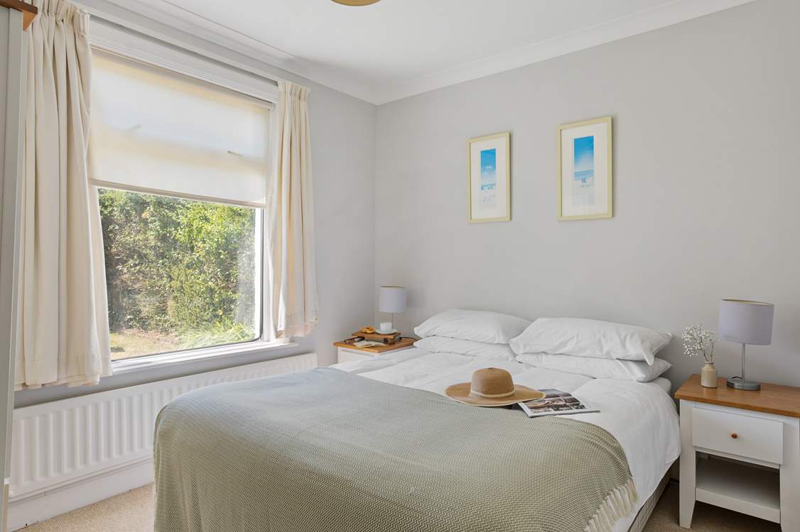 Bedroom 3 sits at the back of Flipflops overlooking the garden.