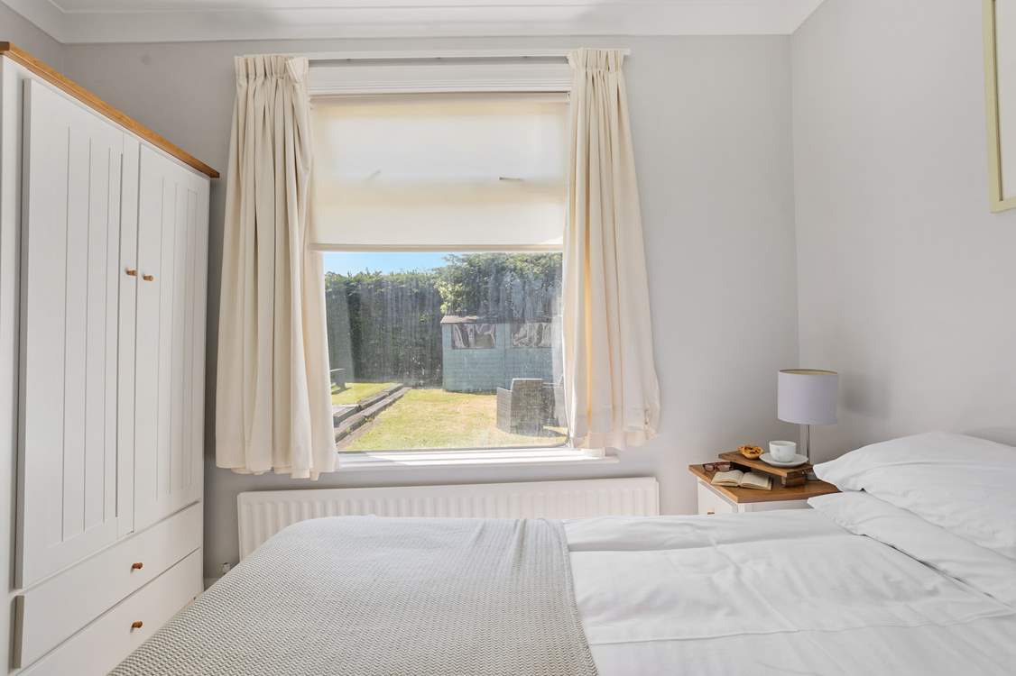 Bedroom 3 sits at the back of Flipflops overlooking the garden.