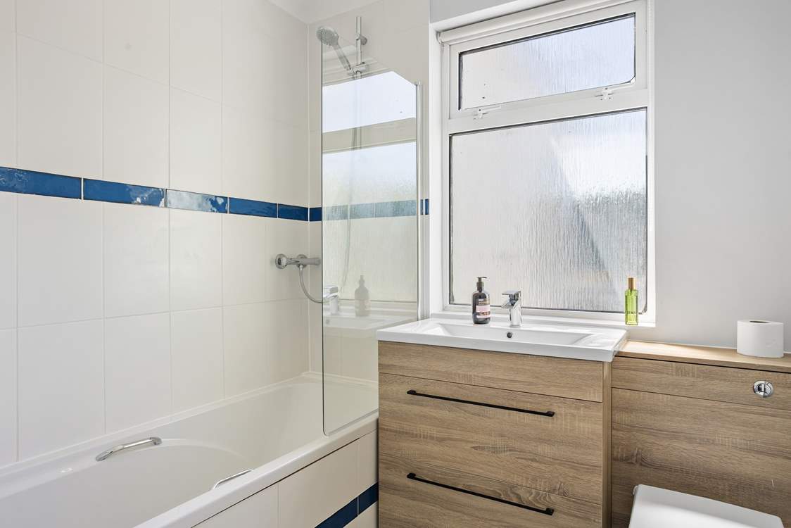 The family bathroom is ideal when you want a leisurely soak or a quick rinse off with a shower.