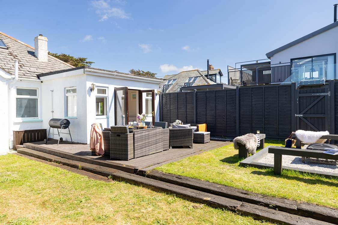 The sunny garden offers a choice of places to sit out and chill.