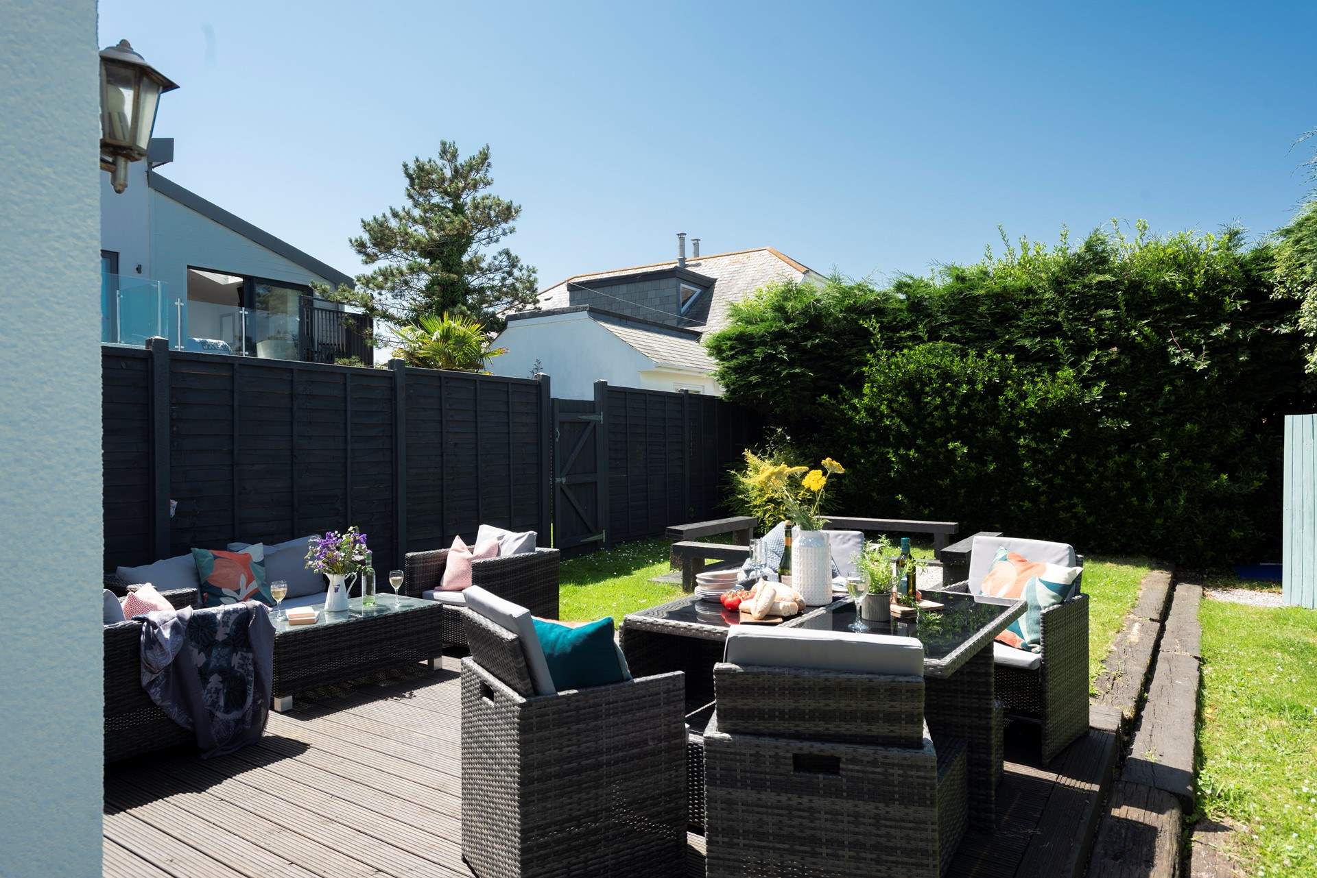The sunny garden offers a choice of places to sit out and chill.