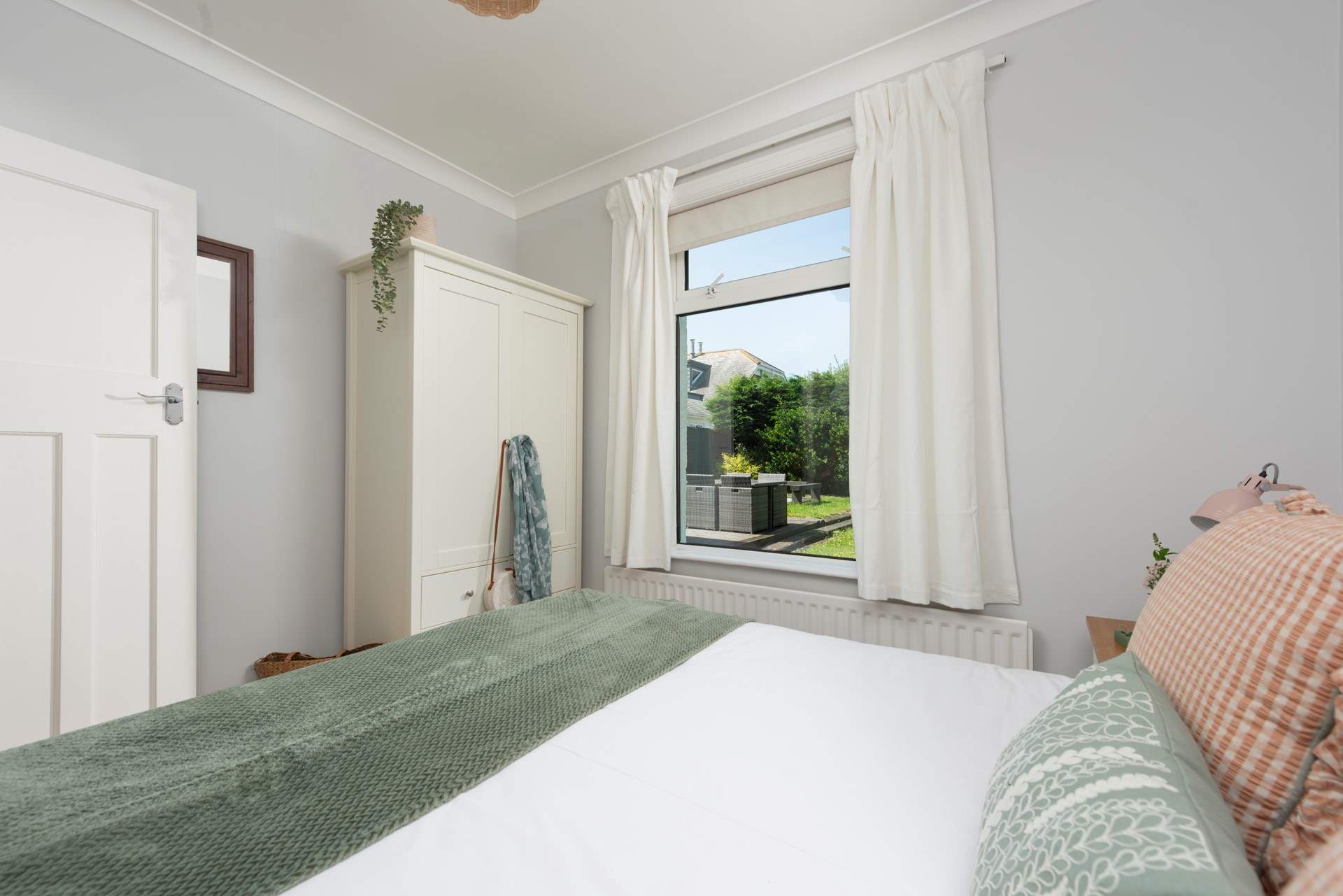 Bedroom 3 with a garden view. 