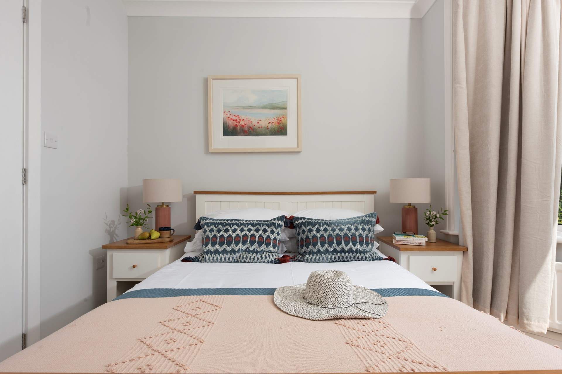 A double bed awaits in the wonderfully light and airy room.