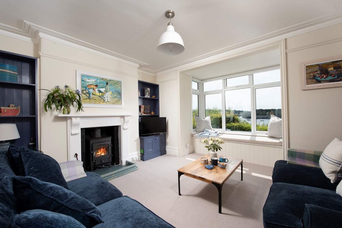 The sitting-room has cosy sofas and a warming wood-burner making Port and Starboard a fabulous year-round location.