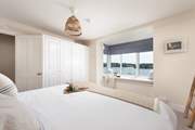 The bedrooms are beautifully furnished to match the seascape view.