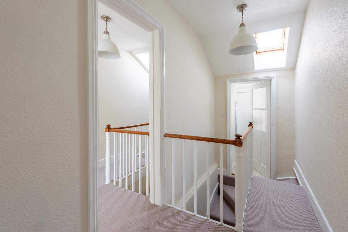 Cleverly converted from two cottages, Port and Starboard retains some charming features such as two separate staircases to the first floor. The bathrooms are found one at each side of the turning stairs.