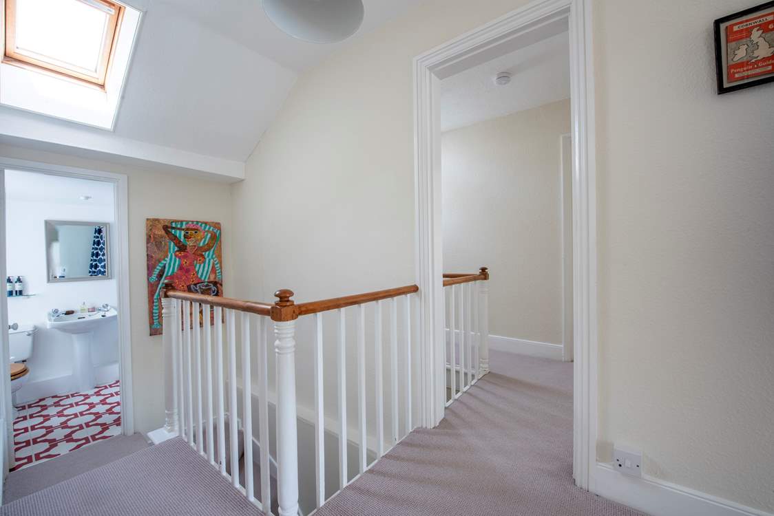 The bathrooms are located two steps down from the first floor.