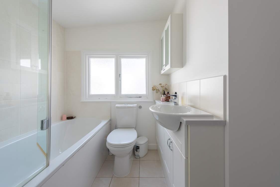 There are two family bathrooms on the first floor, both have a bath with an overhead shower.