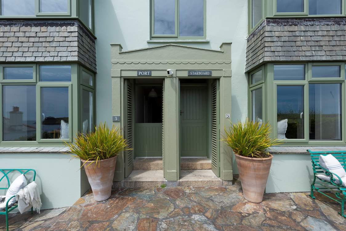 The quirky dual front doors lead inside this beautifully renovated holiday home.