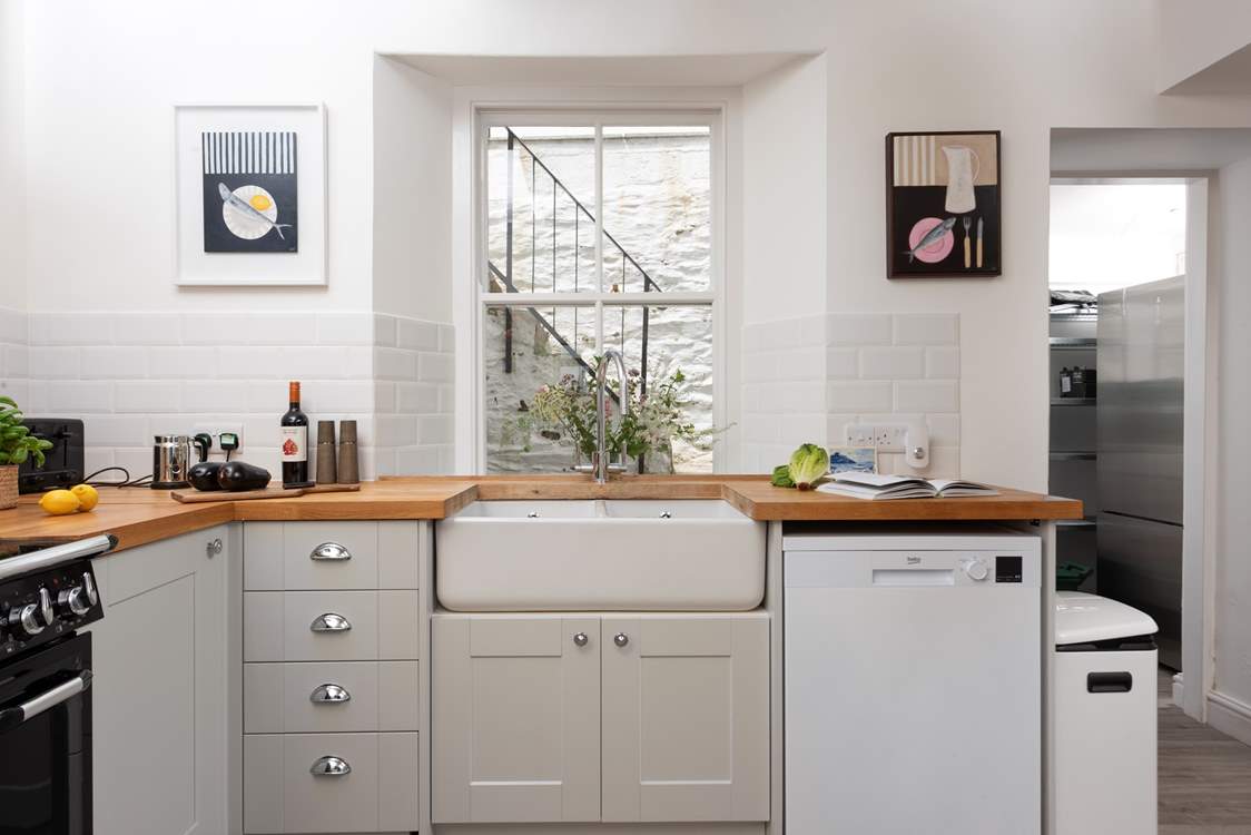 The kitchen has a separate utility-room with a fridge/freezer and storage.