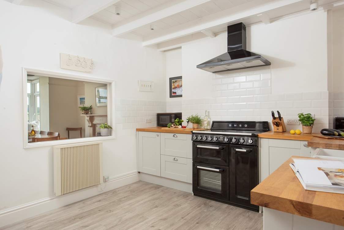 The kitchen has a clever hatch so you can easily chat with your fellow guests.