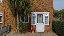 Located in a row of pretty Carrstone cottages.