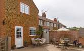 The sunny back garden is perfect for al fresco dining.  - Thumbnail Image