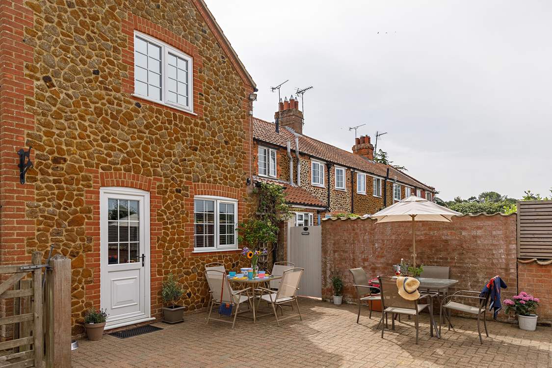 The sunny back garden is perfect for al fresco dining.