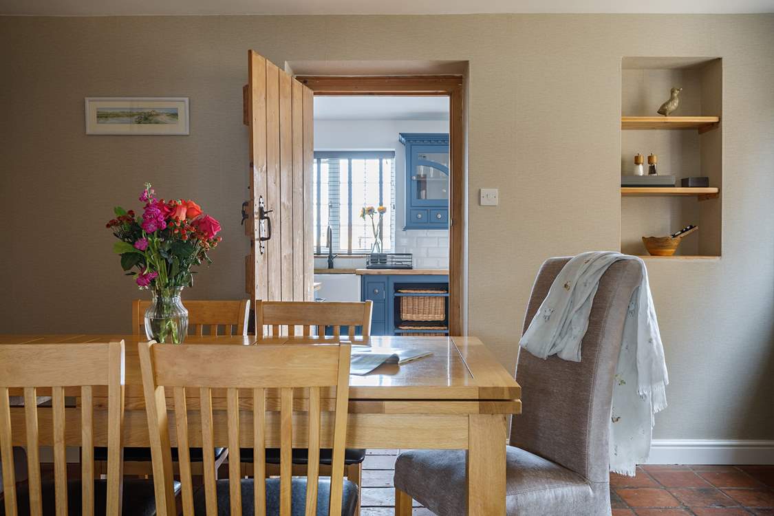 The separate dining-room sits in between the sitting-room and kitchen.