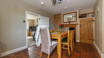 The well-preserved original tiled floor flows through the kitchen and dining-room. 