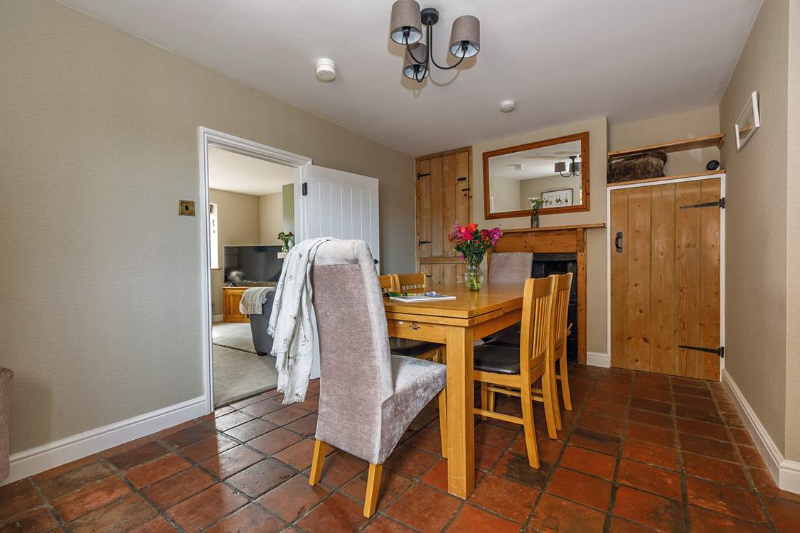The well-preserved original tiled floor flows through the kitchen and dining-room.
