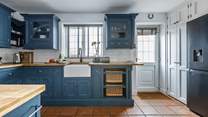 The stylish kitchen has all you need, and a washing machine and drier behind the doors next to the back door. 
