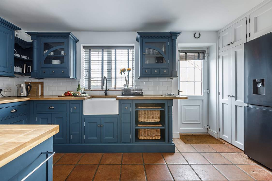 The stylish kitchen has all you need, and a washing machine and drier behind the doors next to the back door.