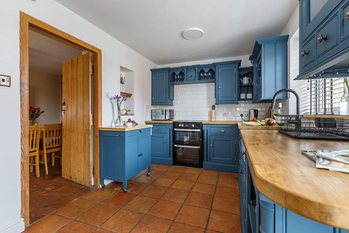 The kitchen is beautifully styled and well-equipped.