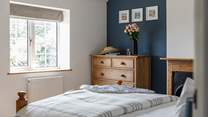 The principal bedroom looks out onto the quiet lane to the front. 
