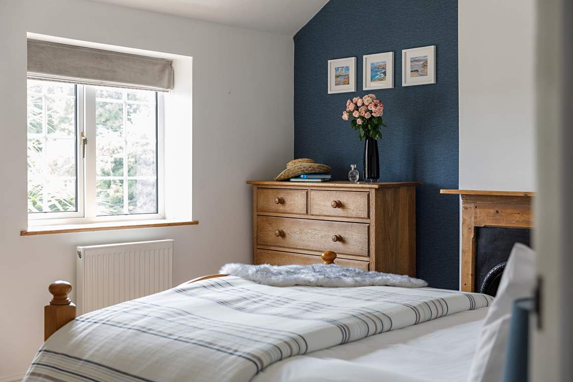 The principal bedroom looks out onto the quiet lane to the front.