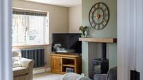 Warm your toes by the wood-burner during cooler months. 