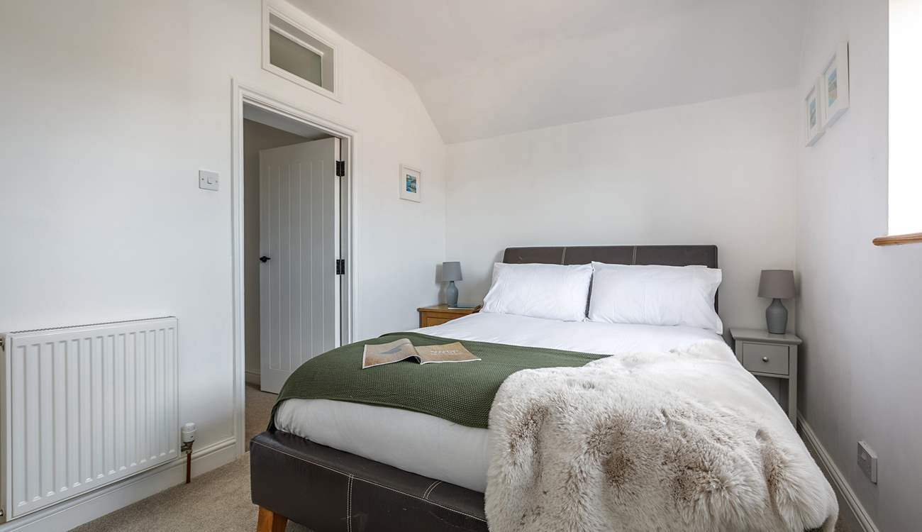 Bedroom 2 is charming with countryside views from the window.