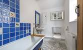 The family bathroom has a bath with a fitted shower.  - Thumbnail Image