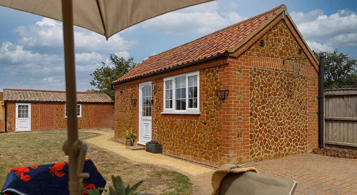 The gorgeous annexe (Garden Retreat) sits in the garden, a perfect bolthole for one or two guests with a sitting-area, double bed and shower-room.