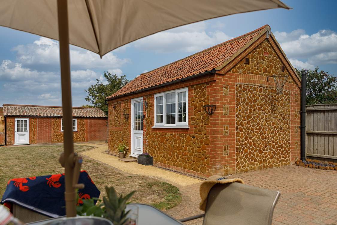 The gorgeous annexe (Garden Retreat) sits in the garden, a perfect bolthole for one or two guests with a sitting-area, double bed and shower-room.