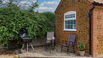 A quiet corner behind the annexe, Garden Retreat, ideal for your morning cuppa or barbecue. 