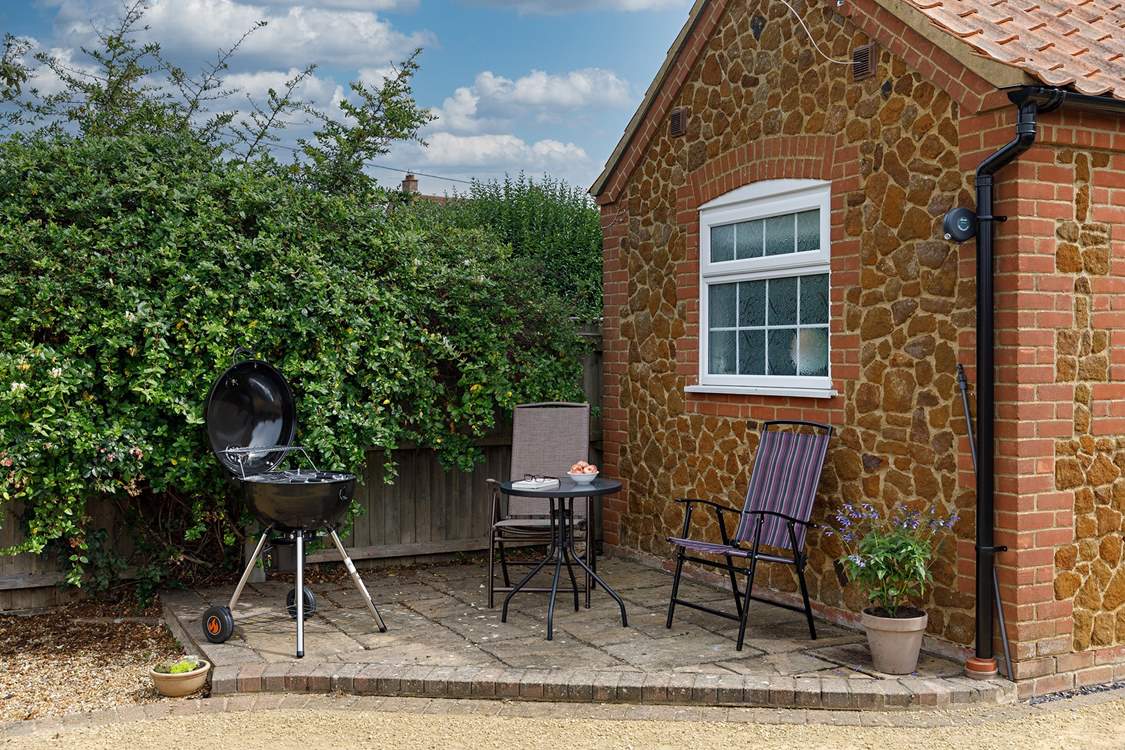 A quiet corner behind the annexe, Garden Retreat, ideal for your morning cuppa or barbecue.