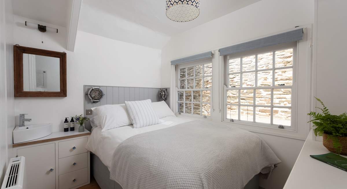 The single bedroom with its own vanity unit/basin sits to the rear of the cottage. Please note, this room now has a single bed and is suitable for one guest. 
