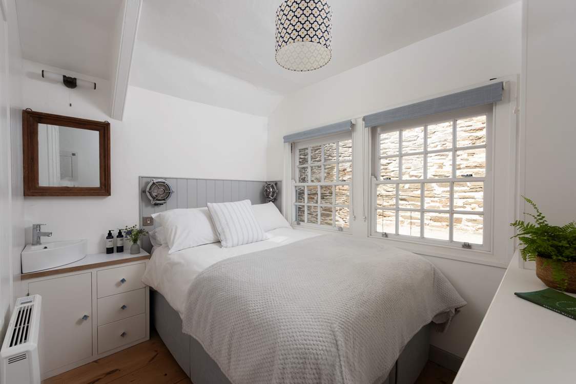 The single bedroom with its own vanity unit/basin sits to the rear of the cottage. Please note, this room now has a single bed and is suitable for one guest.