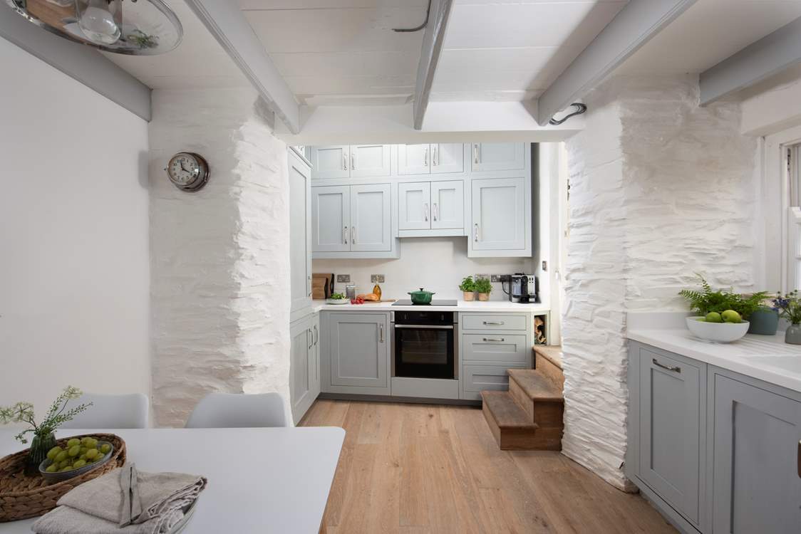 The dining-table is perfectly placed for sociable meals.