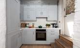 All the equipment you'll need including a slimline dishwasher. The stable-door opens to the rear side alley but there is no outside space.  - Thumbnail Image