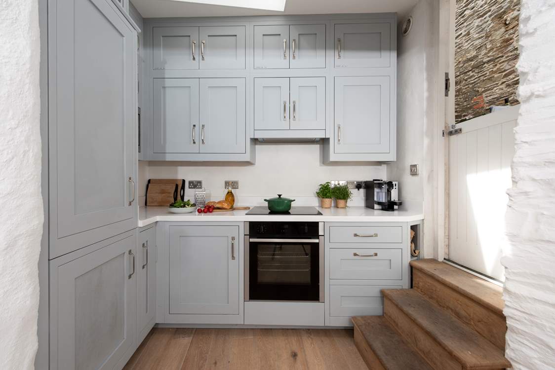 All the equipment you'll need including a slimline dishwasher. The stable-door opens to the rear side alley but there is no outside space.