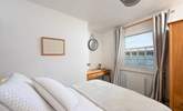 Spend enchanting hours watching the boats ply the waters around the harbour from the double bedroom.  - Thumbnail Image