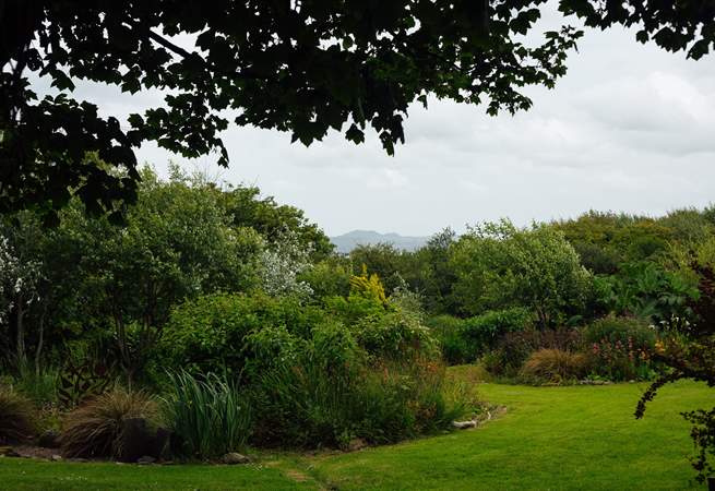 Enjoy the one and a half acres of landscaped gardens. 