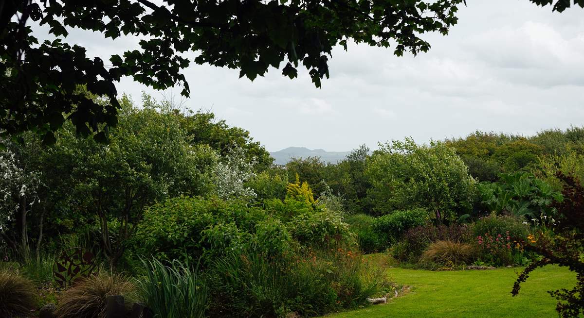 Enjoy the one and a half acres of landscaped gardens. 