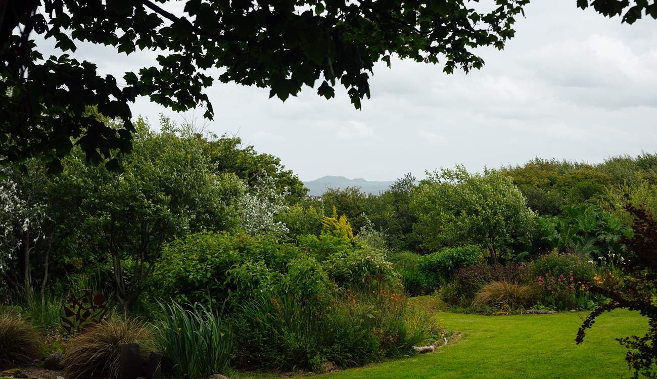 Enjoy the one and a half acres of landscaped gardens. 