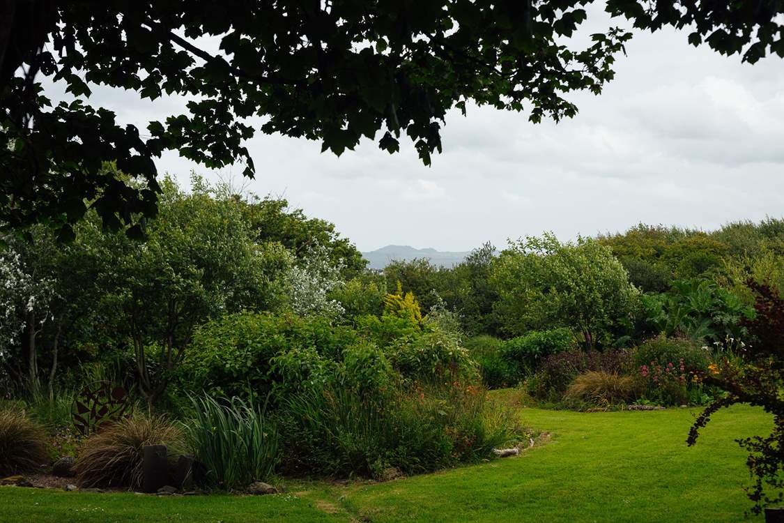 Enjoy the one and a half acres of landscaped gardens.
