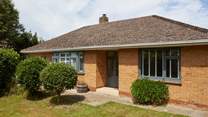 The delightful front garden creates privacy from the road.