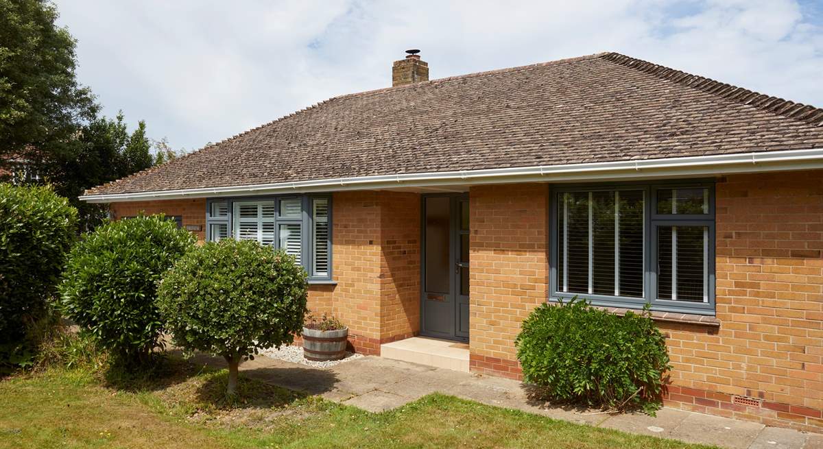 The delightful front garden creates privacy from the road.