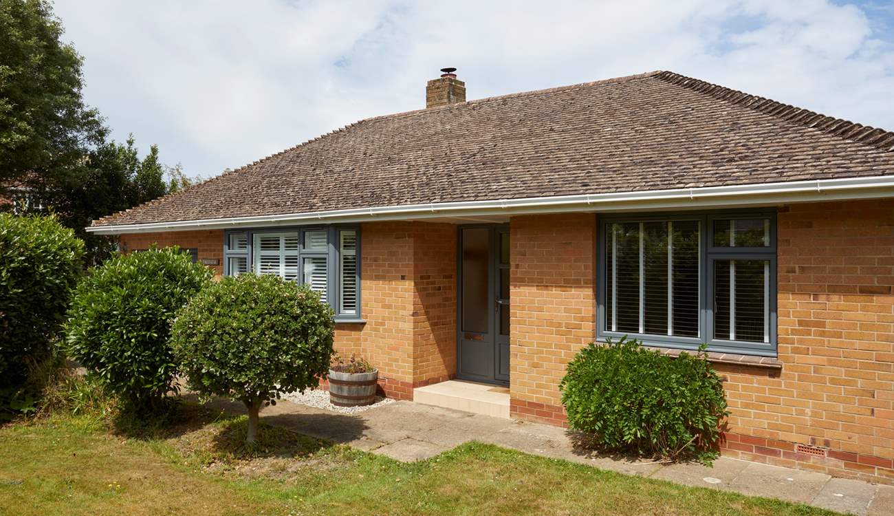 The delightful front garden creates privacy from the road.