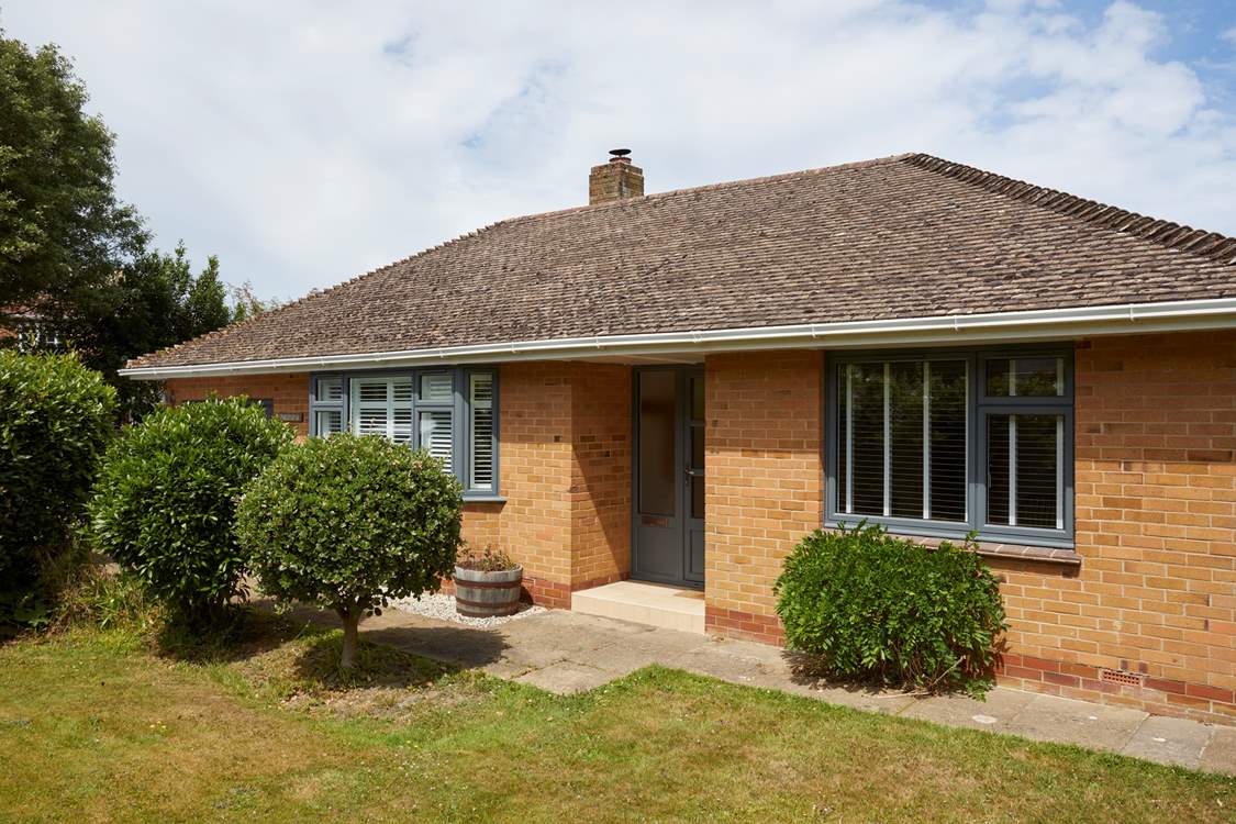 The delightful front garden creates privacy from the road.