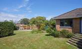 The enclosed rear garden offers a stunning outdoor retreat. - Thumbnail Image